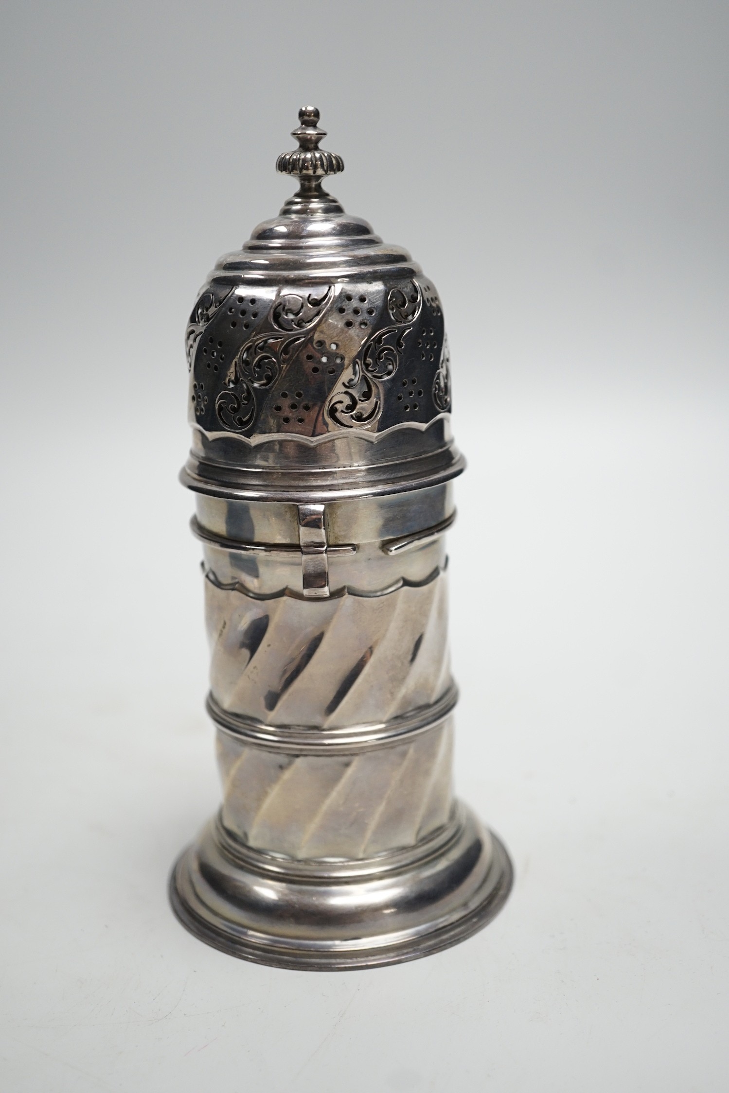 An Edwardian silver lighthouse sugar caster, with spiral body, by Nathan & Hayes, Chester, 1908, 18cm, 8.3oz.